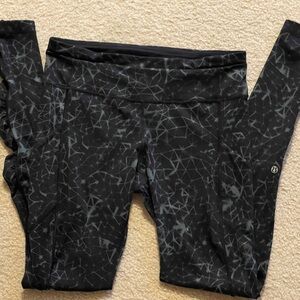 Lululemon leggings. Ruched at the legs. Black with gray spider markings. Size 8